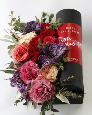 With Champagne & Anniversary Wine Tube size,  inches height and  inches wide.