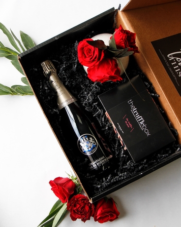 With Barons De Rothschild Blanc de Blanc Champagne size,  inches height and  inches wide.